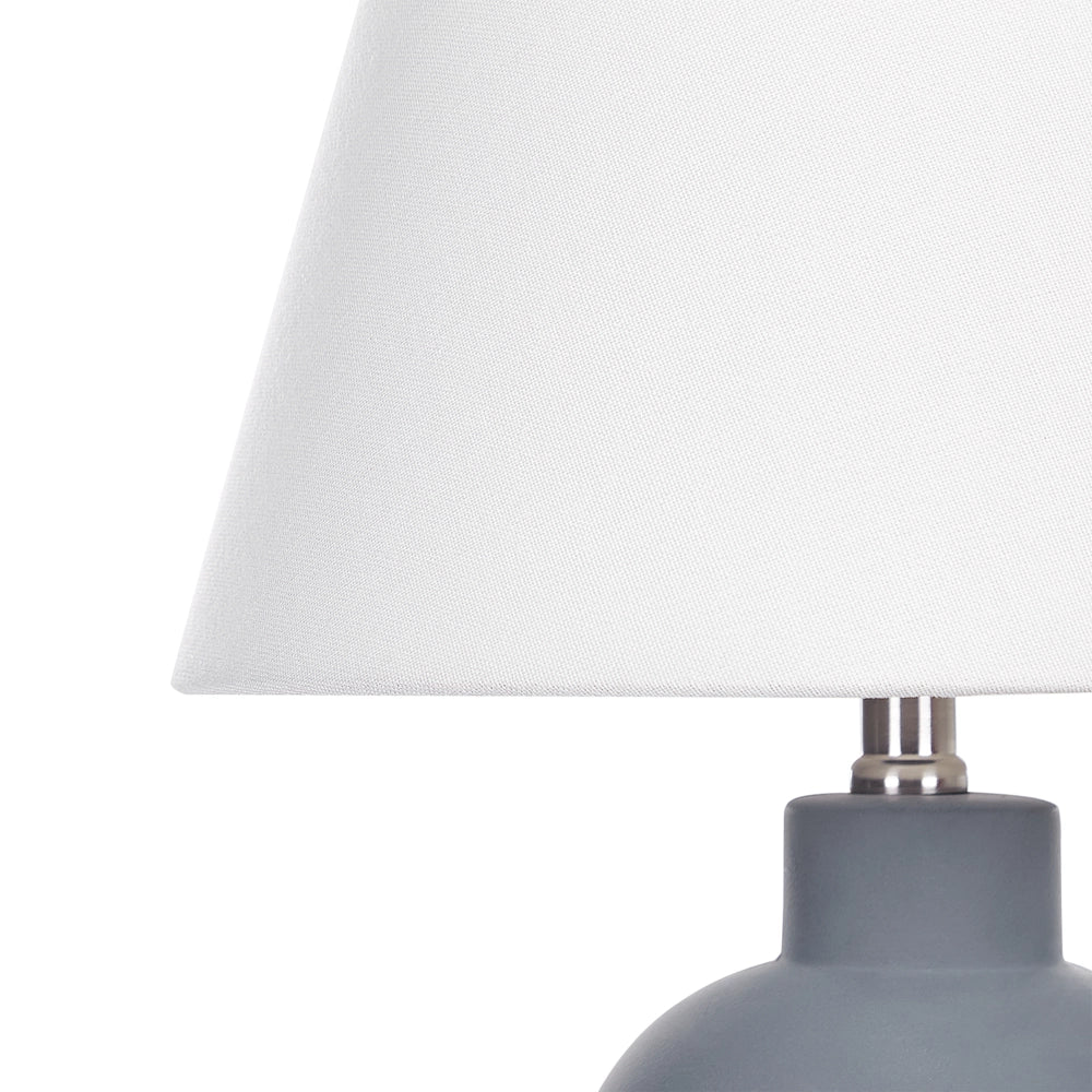 Lampada da tavolo in ceramica grigio con paralume a tamburo in lino base minimalista design stile contemporaneo