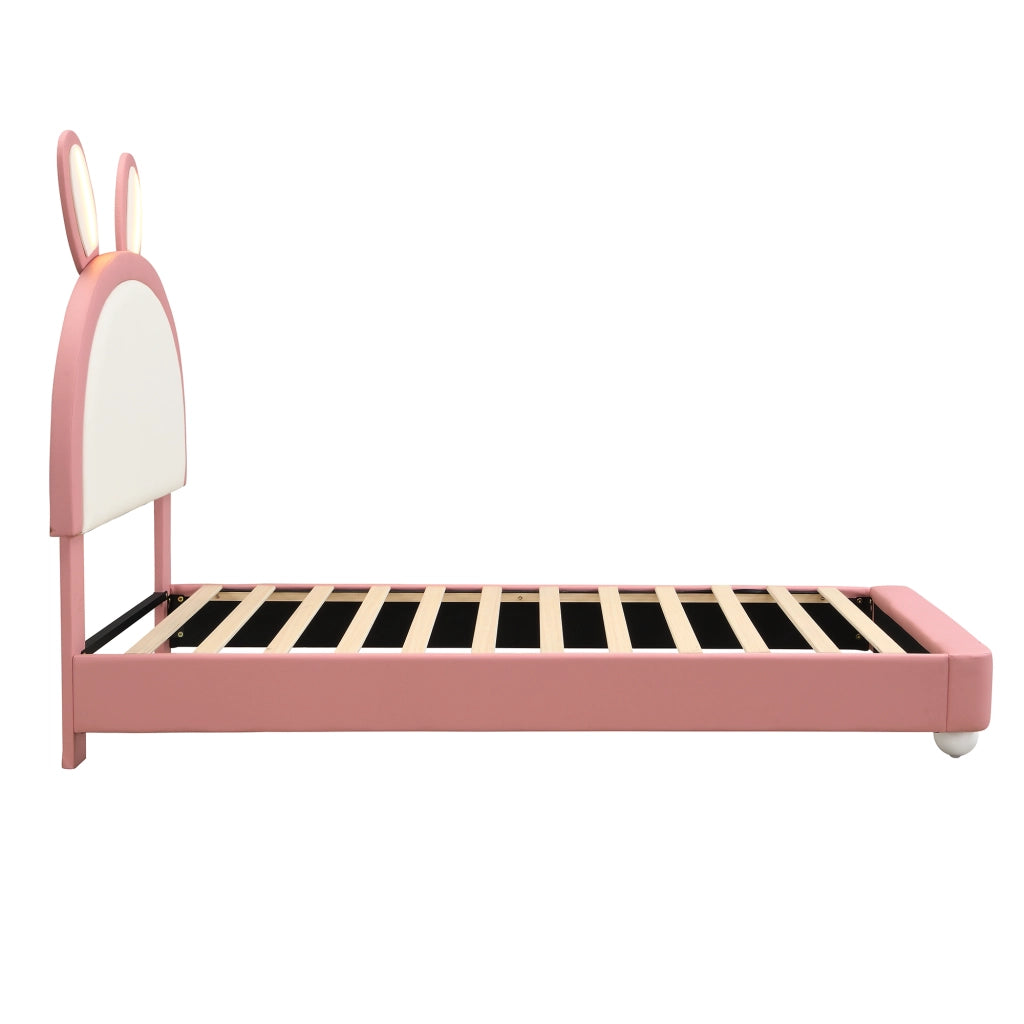 Letto per bambini 90x200 cm, testiera a forma di coniglio, luci a LED, bordi imbottiti antiurto, materiale PU, rosa + bianco
