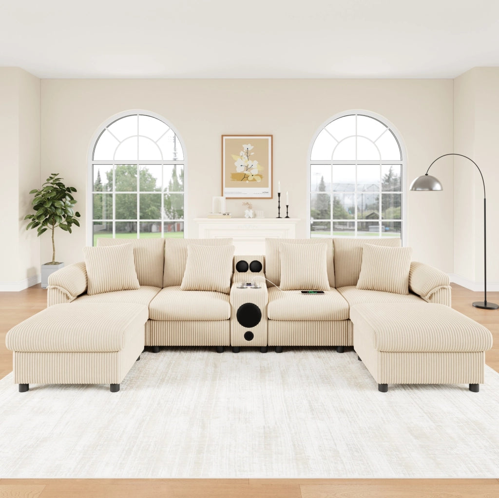 Divano modulare U/L in velluto a coste beige con console Bluetooth; ricarica wireless; USB e Type-C