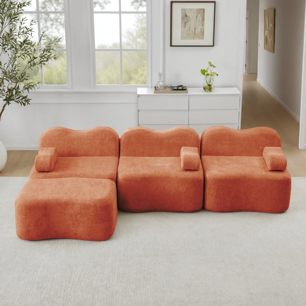 Divano angolare modulare senza struttura con pouf collegabile e seduta profonda in velluto arancione