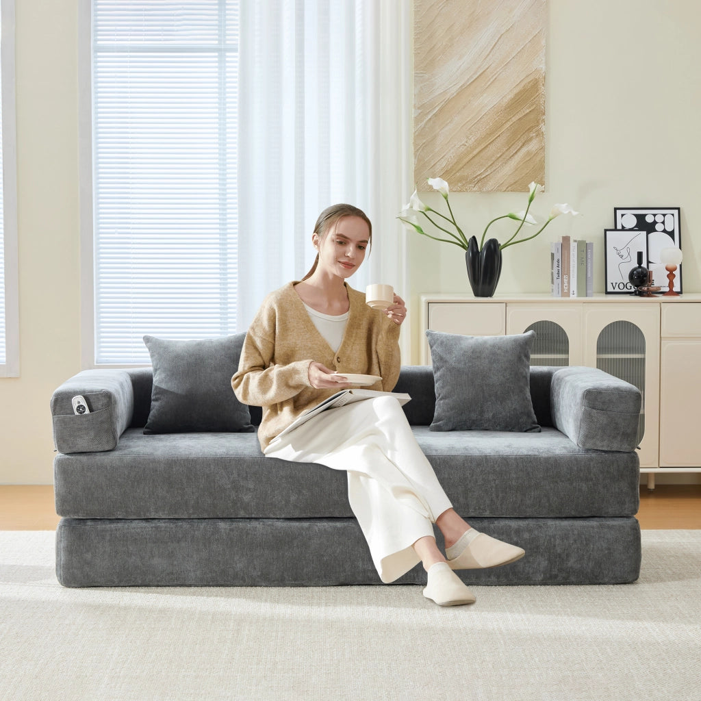 Divano modulare in chenille grigio scuro con tasche laterali, base antiscivolo e struttura componibile