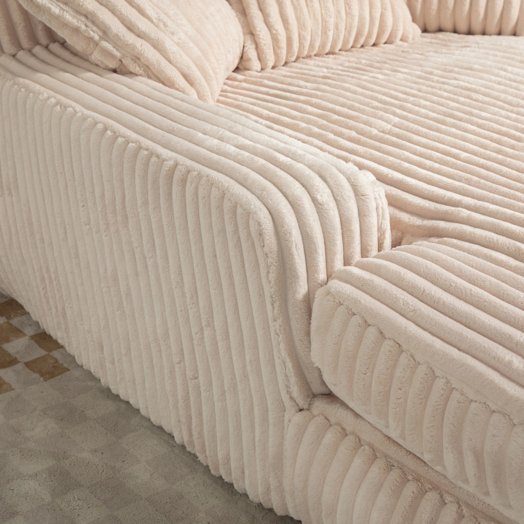 Poltrona chaise longue beige in velluto a coste con 3 cuscini; 125 x 155 x 63 cm