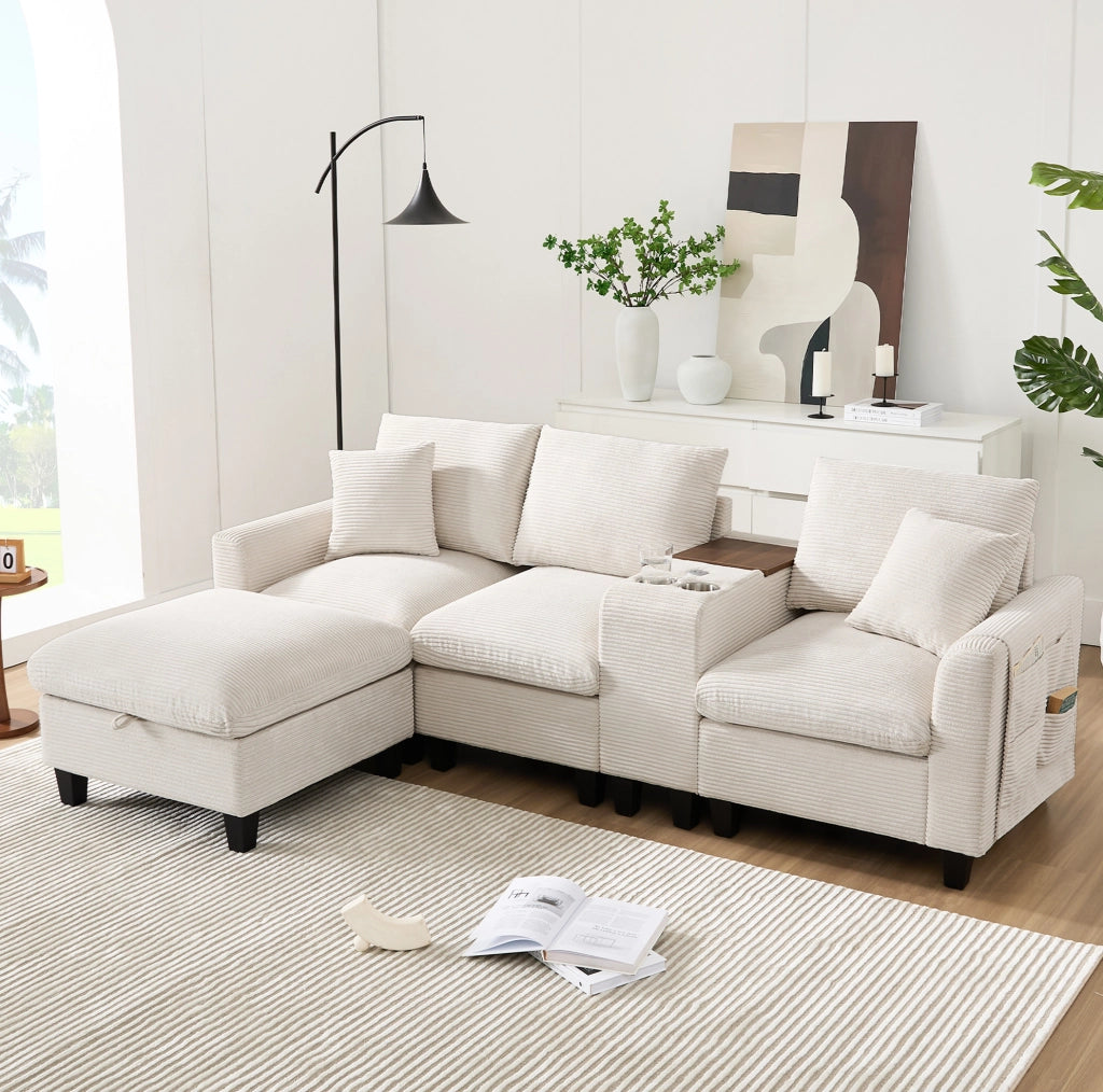 Divano angolare modulare 4 posti con console; 2 portabicchieri; 2 porte USB; pouf e cuscini in velluto a coste beige