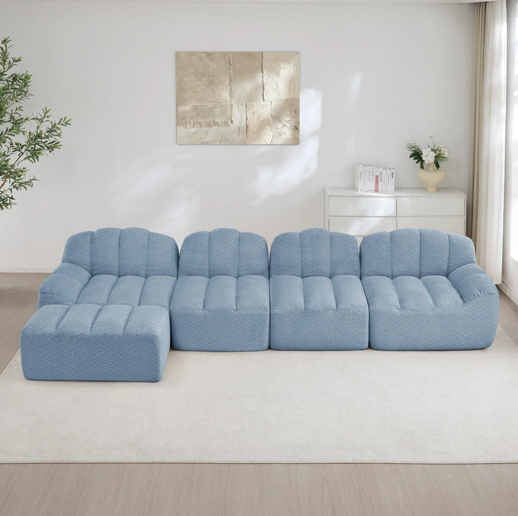 Divano modulare 4 posti con ottomana collegabile; 366x165x79 cm; pile granulato blu