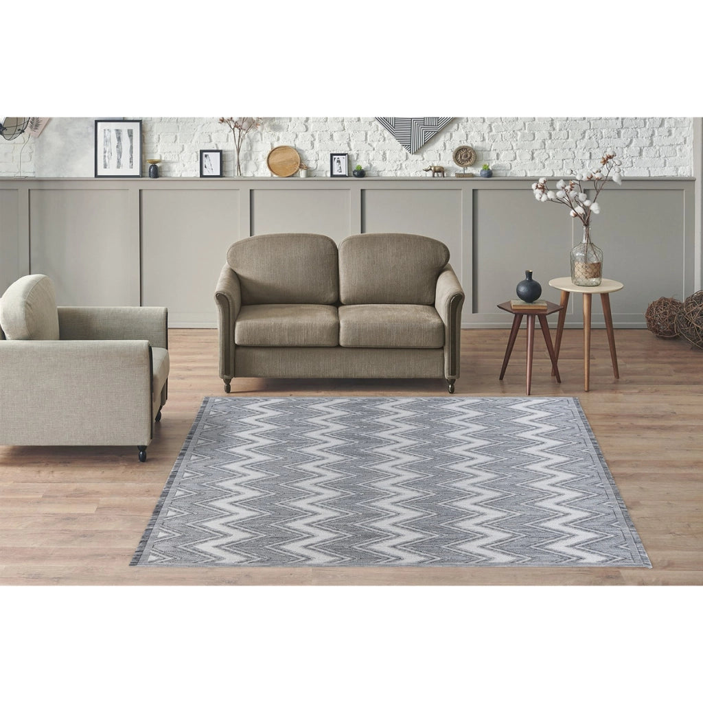 Tappeto moderno Sarai con motivo a zig-zag grigio e bianco
