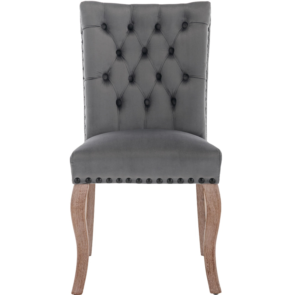 Sedia da pranzo in velluto grigio con schienale decorativo; struttura in legno massello
