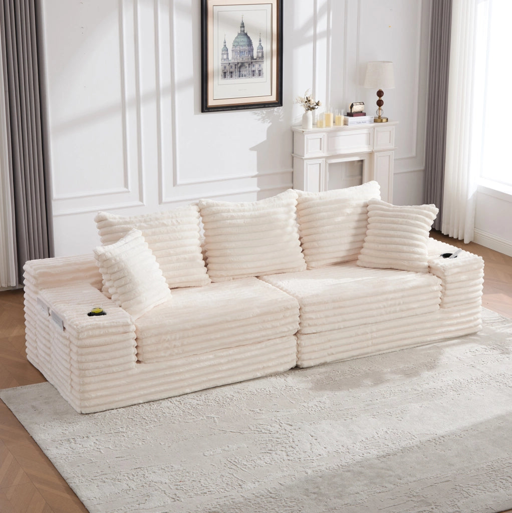 Divano modulabile in velluto a coste beige con tasche laterali e portabevande