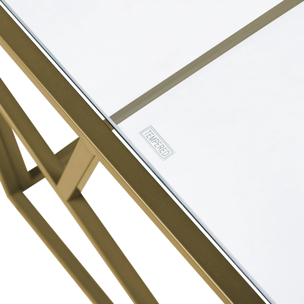 Tavolino da caffè con struttura in metallo dorato piano in vetro design geometrico glam