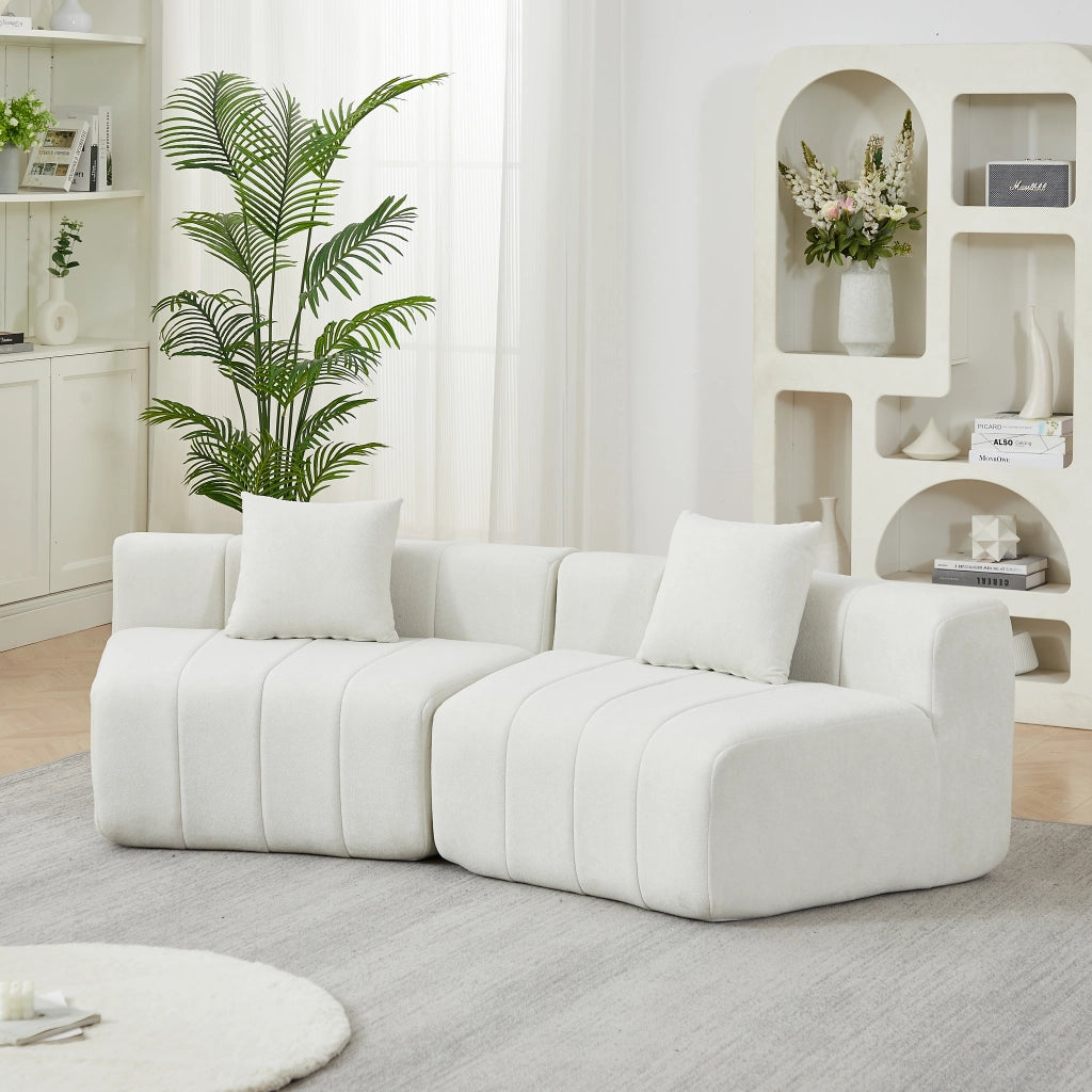 DIVANO Modulare curvo in chenille beige con 2 cuscini