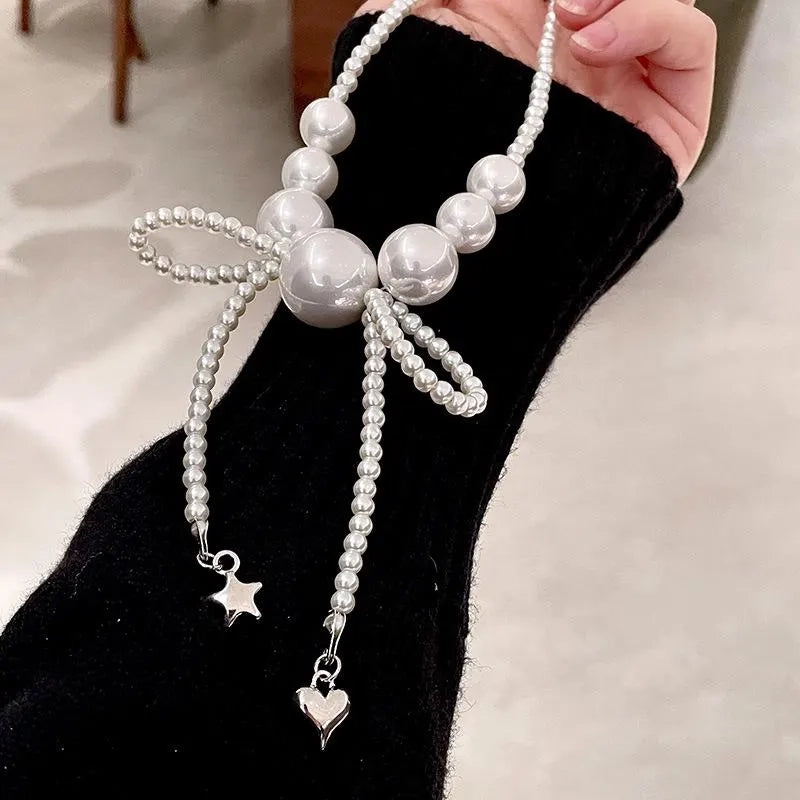 Collana con fiocco grande e perle, realizzata a mano, regalo di Natale o di compleanno.