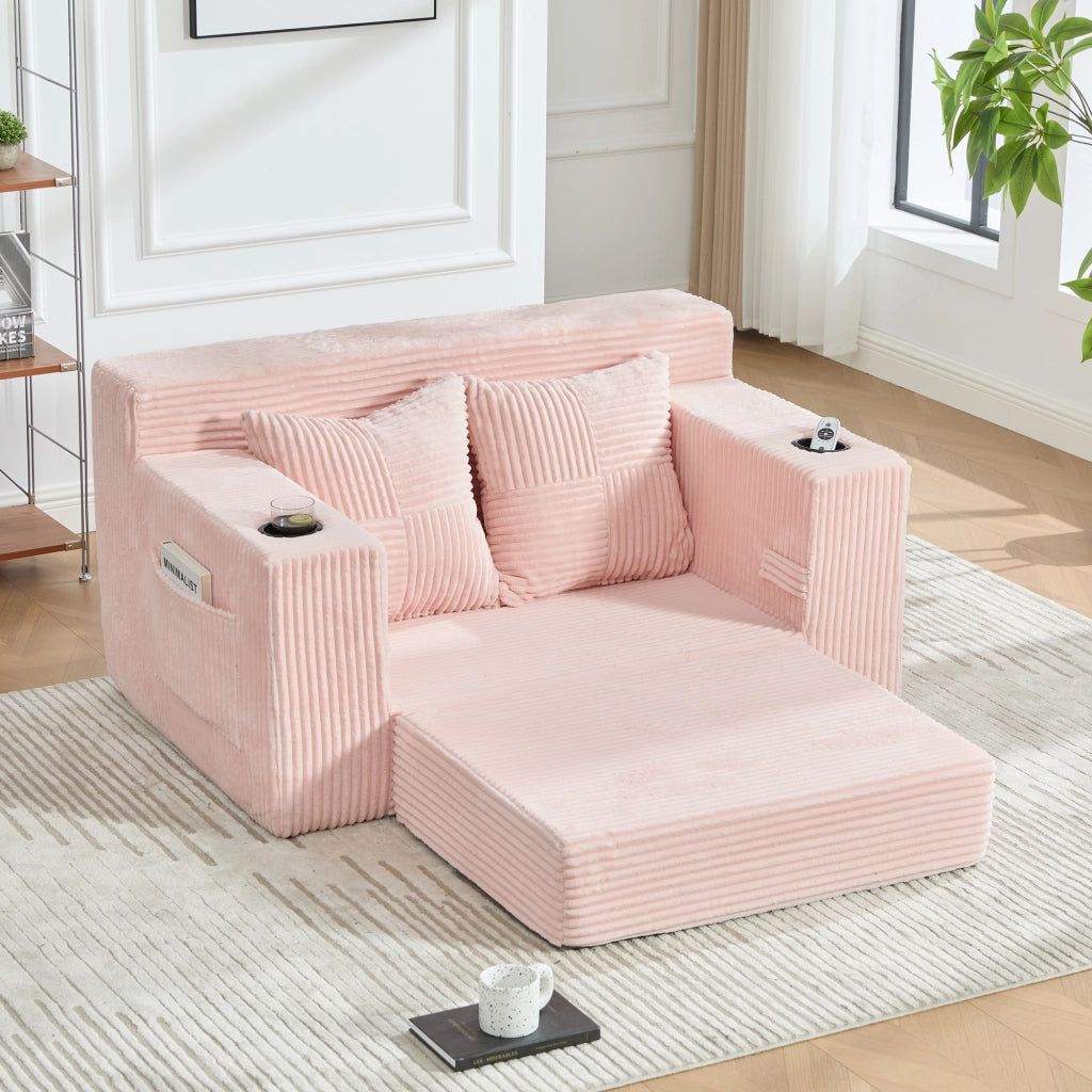 Divano pouf in velluto a coste rosa con due cuscini tasche laterali e braccioli