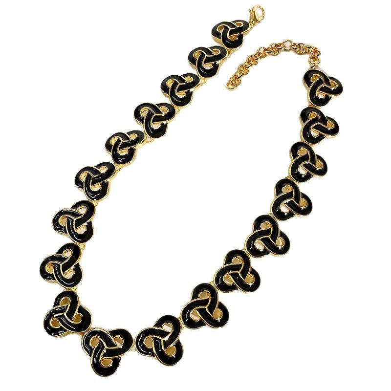 Set di collana vintage fatta a mano con smalto nero e oro e fiori dallo stile retr¨° esagerato e audace.