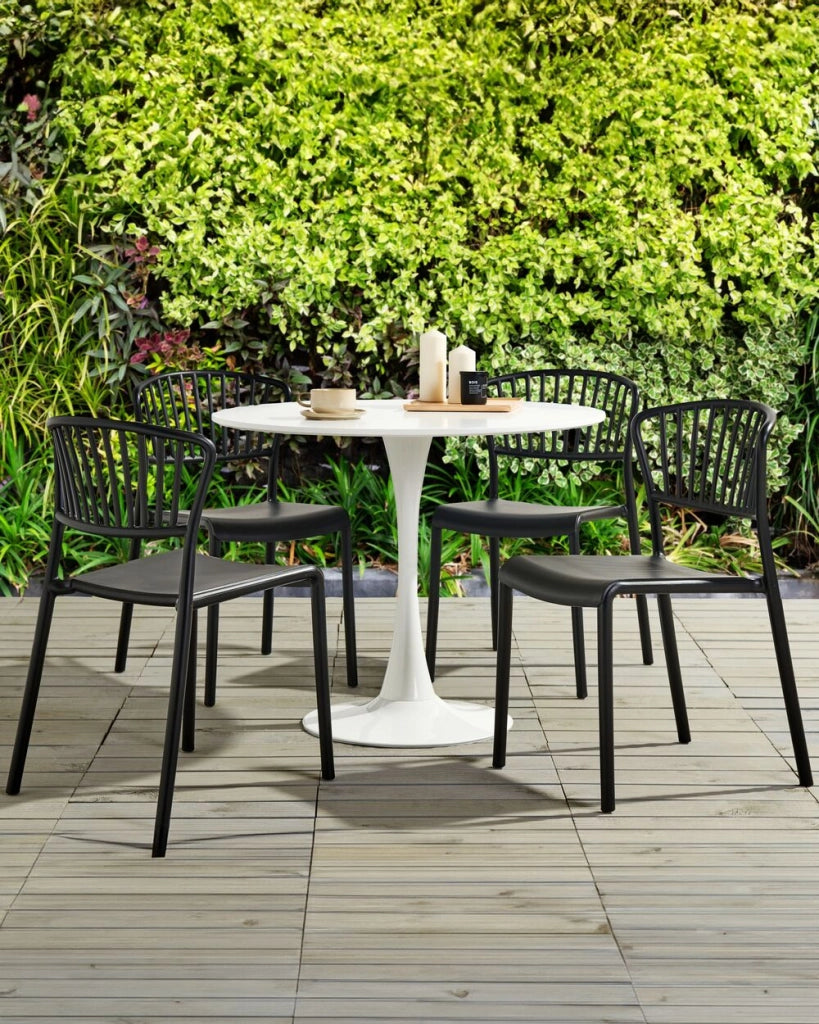 Set di 4 sedie da pranzo in plastica nero per interni ed esterni da giardino impilabili in stile minimalista