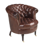 Poltrona Chester con seduta circolare in pelle marrone cognac