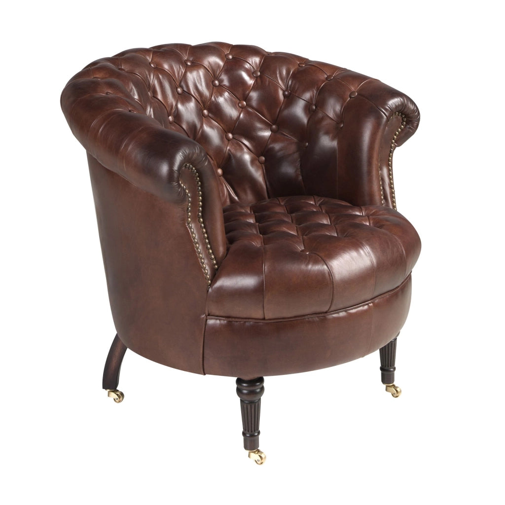 Poltrona Chester con seduta circolare in pelle marrone cognac