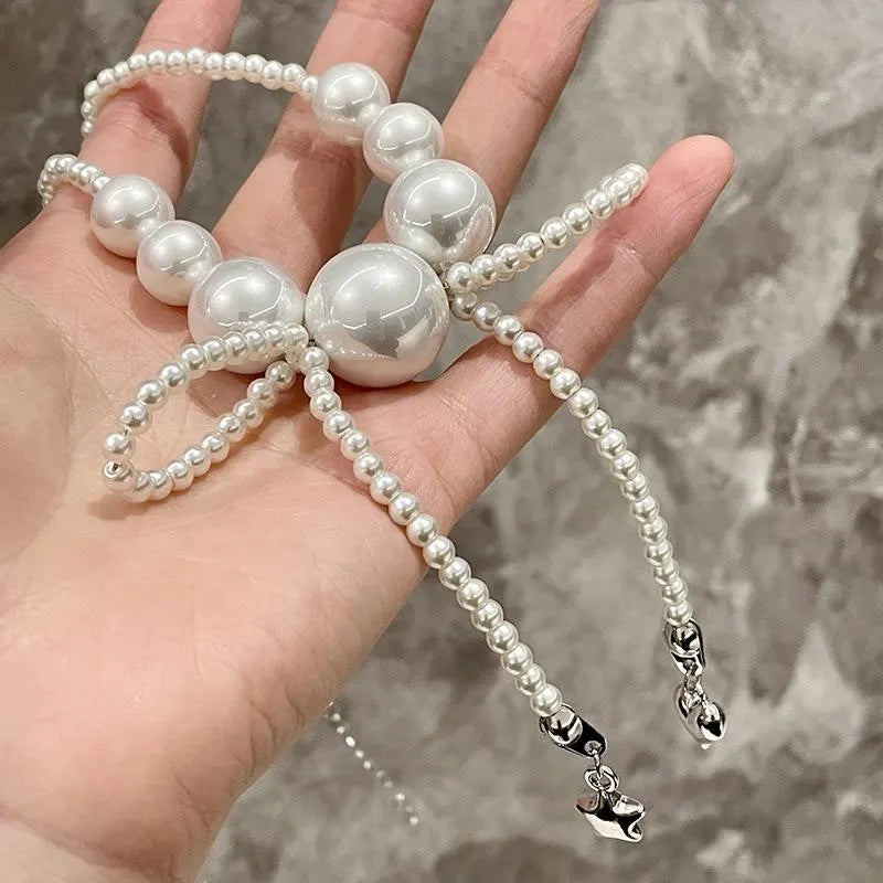 Collana con fiocco grande e perle, realizzata a mano, regalo di Natale o di compleanno.