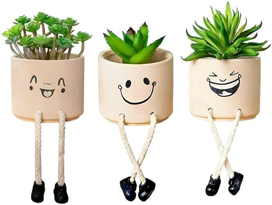Vaso di fiori con faccia sorridente - Figura di vaso accattivante - Adatto per piante grassocce - "Gambe" pendenti in fibra di cocco - Tono morbido rosa Morandi - Tocco giocoso per l'arredamento - Supporto per piante