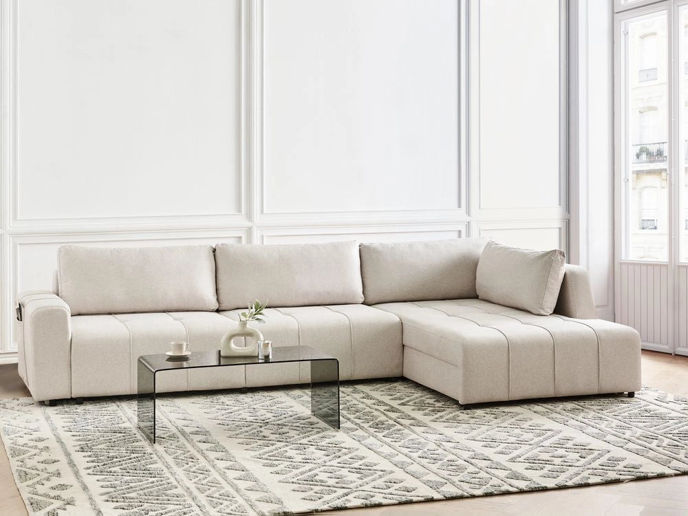 Divano imbottito a 4 posti ad angolo in tessuto beige chiaro con braccioli porta riviste e contenitore stile moderno soggiorno