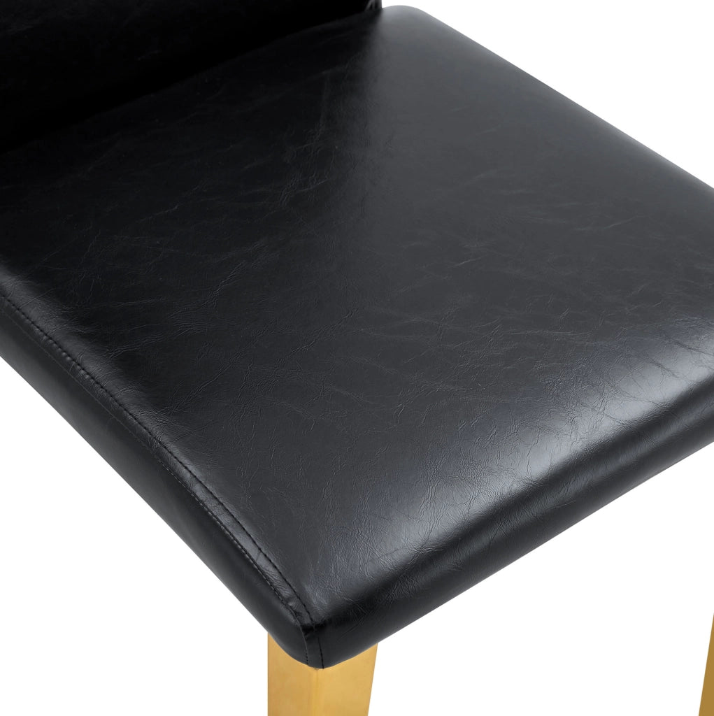Set di 4 sedie da pranzo nere e oro in PU e metallo