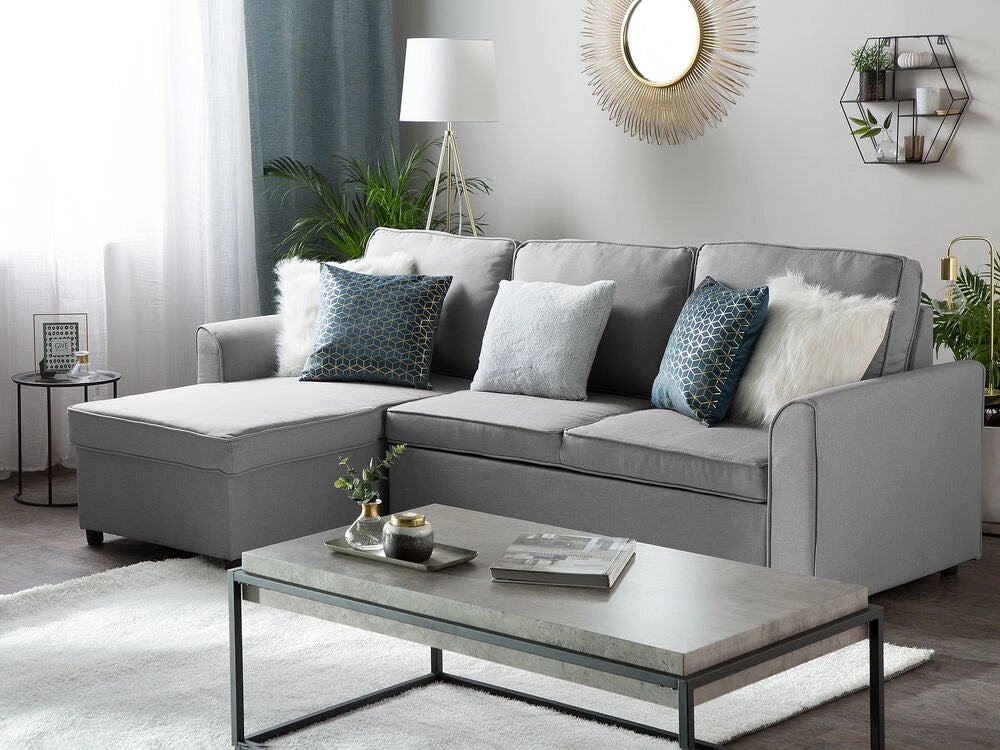 Divano letto ad angolo imbottito in tessuto grigio con orientamento a versione destra con letto contenitore
