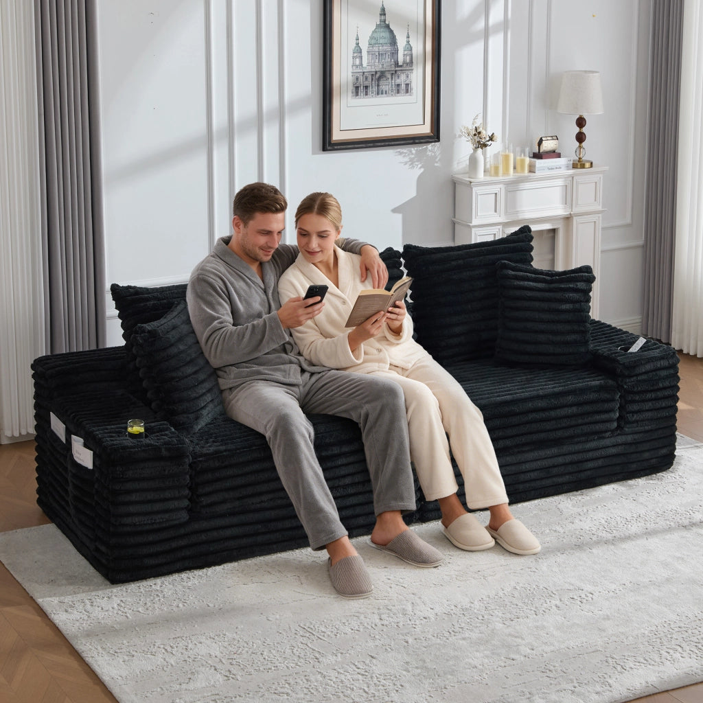 Divano letto modulare in tessuto effetto velluto con schienale alto, tasche laterali e portabicchieri nero