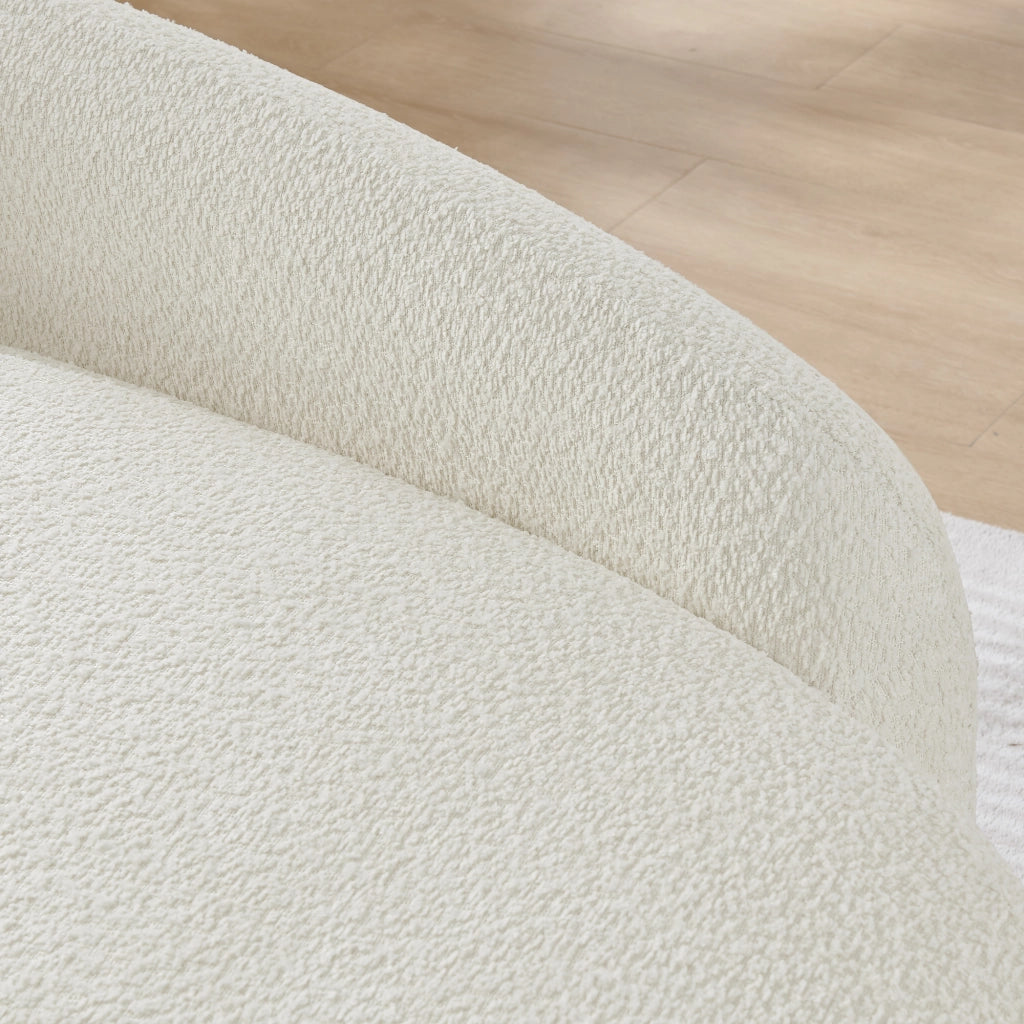 Divano compatto in tessuto Teddy beige con design arrotondato e cuscino integrato