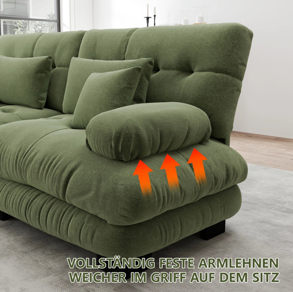 Divano modulare in ciniglia verde con braccioli arrotondati; cuscini lombari e decorativi