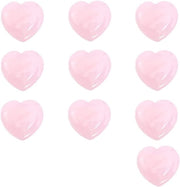 Strumento di massaggi facciali a forma di cuore con cristallo di roccia rosa.