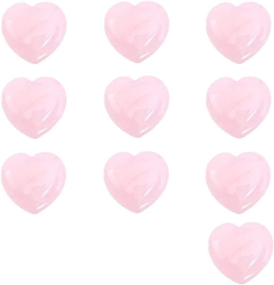 Strumento di massaggi facciali a forma di cuore con cristallo di roccia rosa.