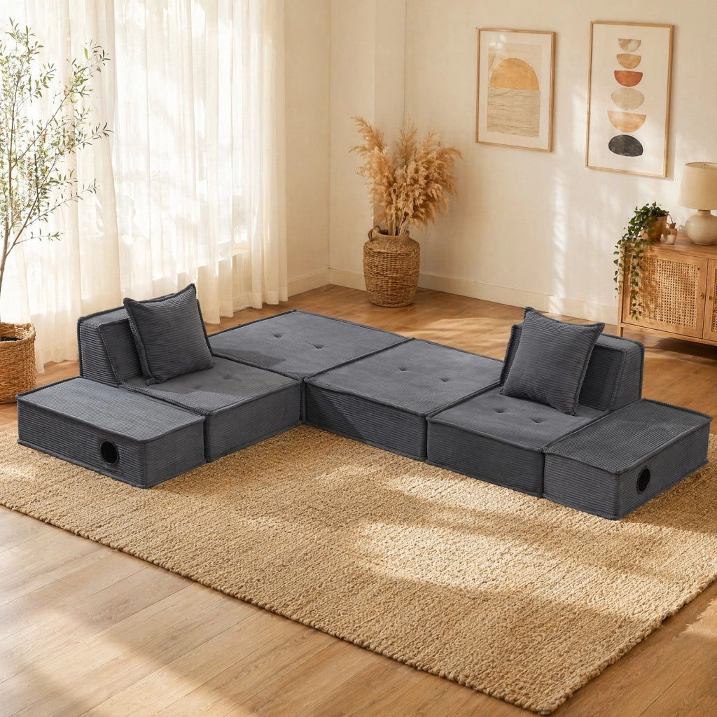 Pouf sofa modulare grigio scuro in velluto a coste con cuscini e tasche laterali