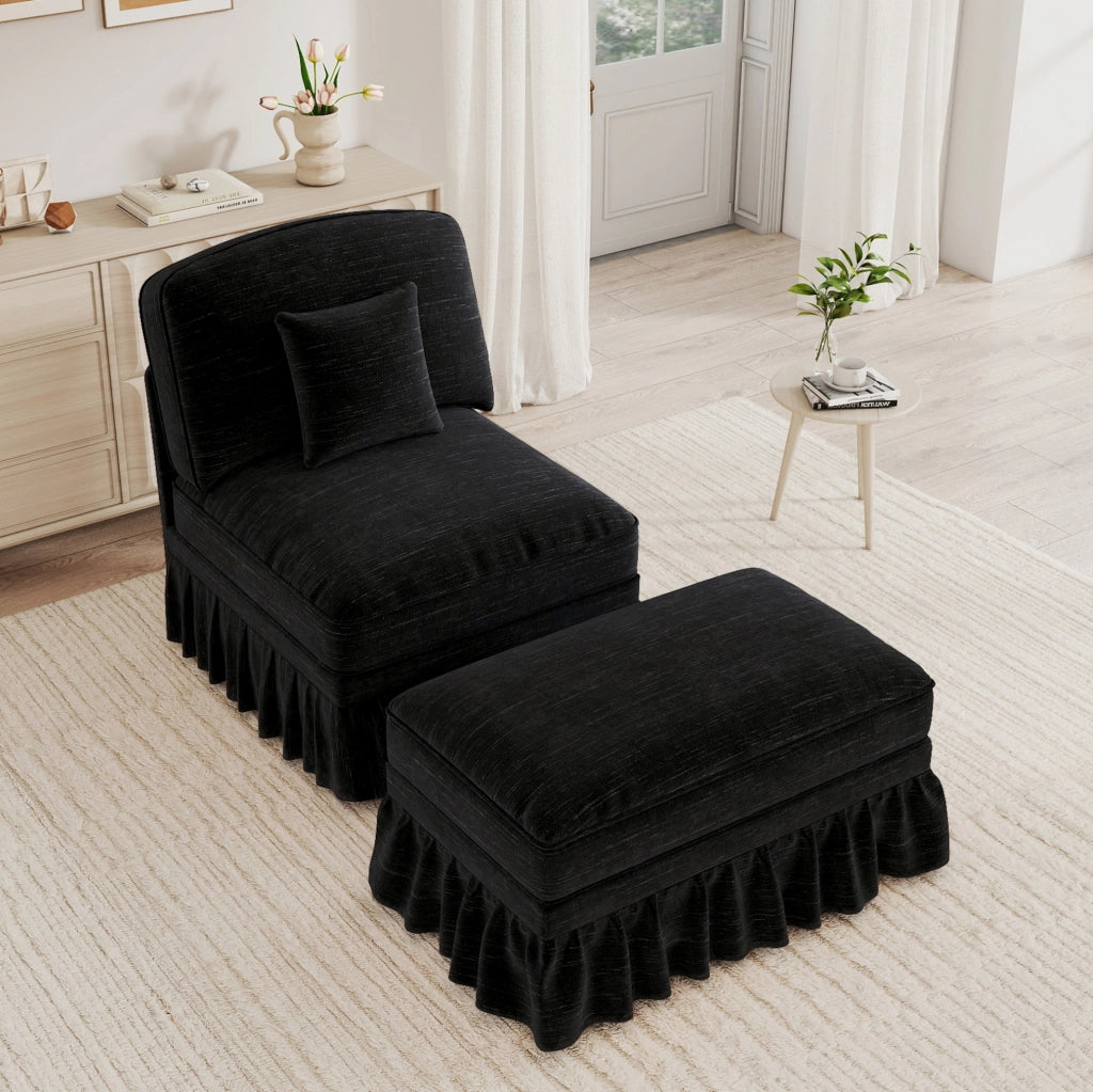 Poltrona lounge in chenille con pouf; balza removibile e cuscino mobile; nero