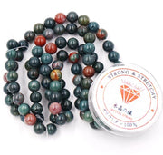 Kralen con corda per l'assemblaggio di gioielli Pietre d'arredo per uso DIY Pietre energetiche bracciale curativo 6 mm = 128 pezzi e 1 rotolo di corda Pietra di sangue 6 mm