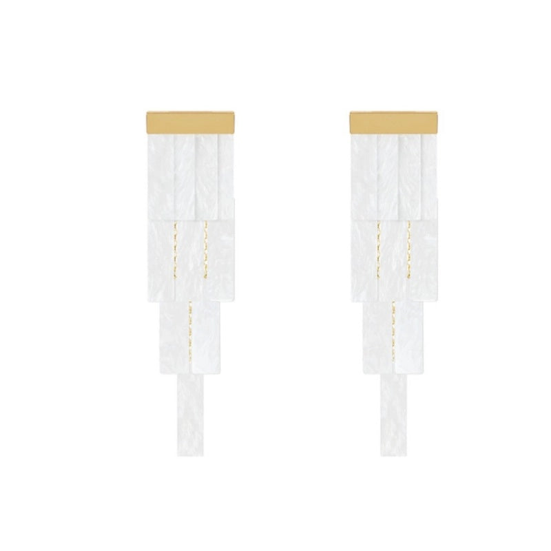 Orecchini vintage con nappe a forma di conchiglia.