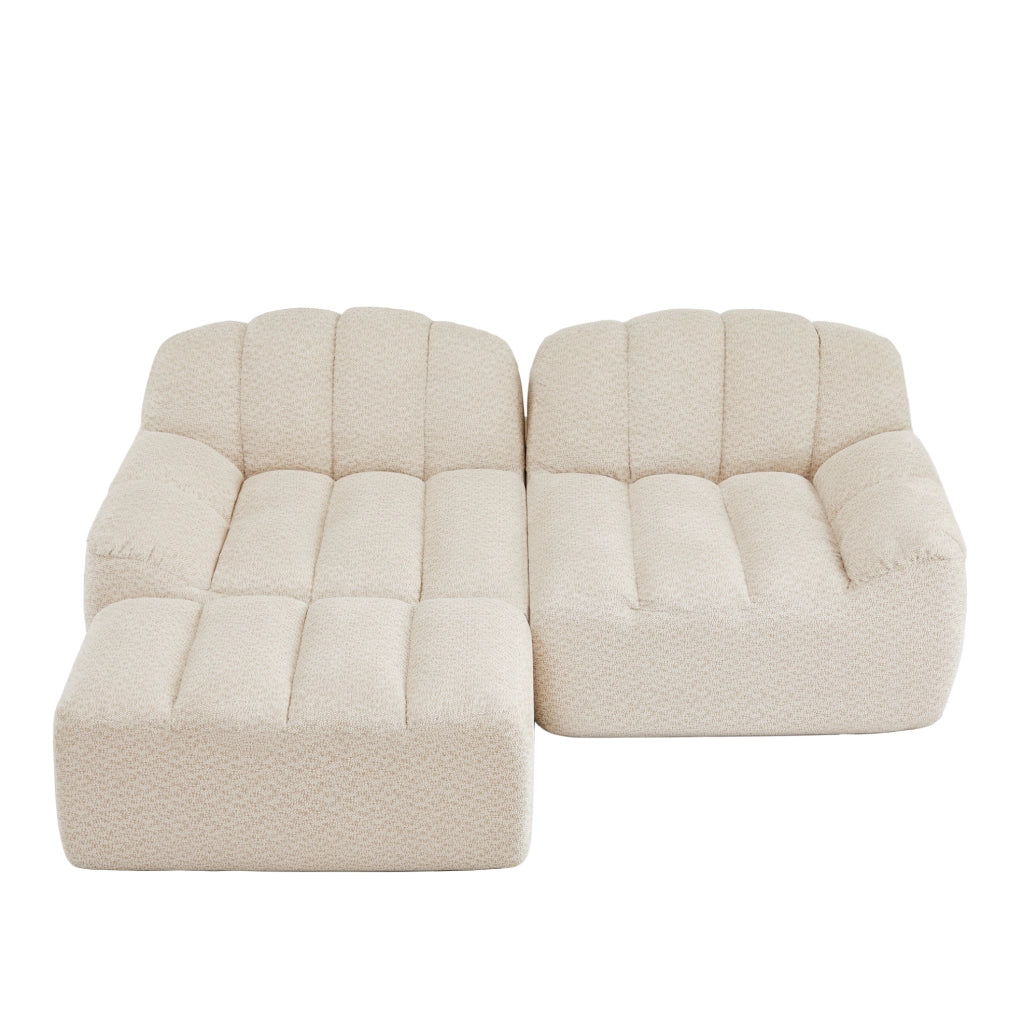 Divano modulare angolare 210.0x165.0x79.0 cm con ottoman senza montaggio in pile granulato beige e bianco