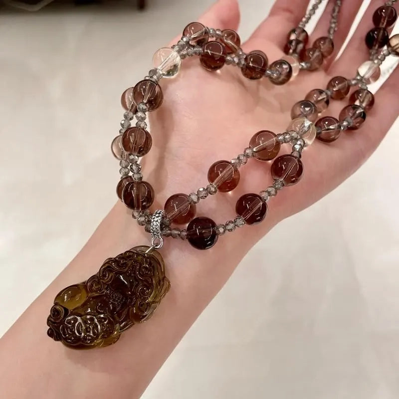 Collana con pendente a perline di cristallo marrone: gioiello a doppio strato fatto a mano