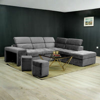 Divano angolare reversibile Positano grigio con poggiatesta regolabili, pouf e funzione letto