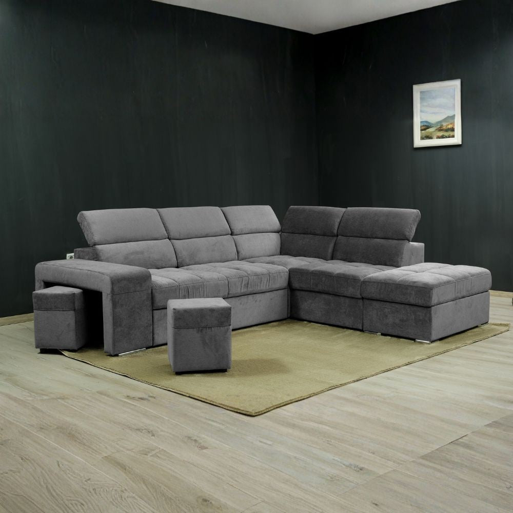 Divano angolare reversibile Positano grigio con poggiatesta regolabili, pouf e funzione letto