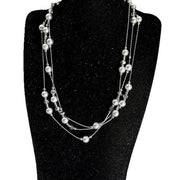 Collana lunga con stella di perle grigio argento