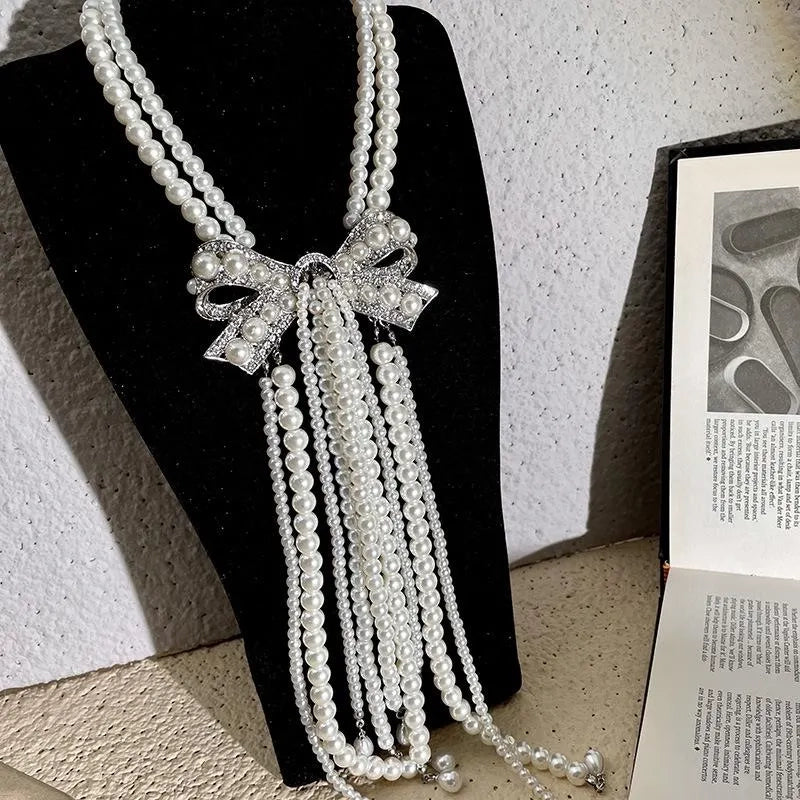 Collana con fiocco doppio strato e nappa di perle, realizzata a mano, regalo di Natale o di compleanno.