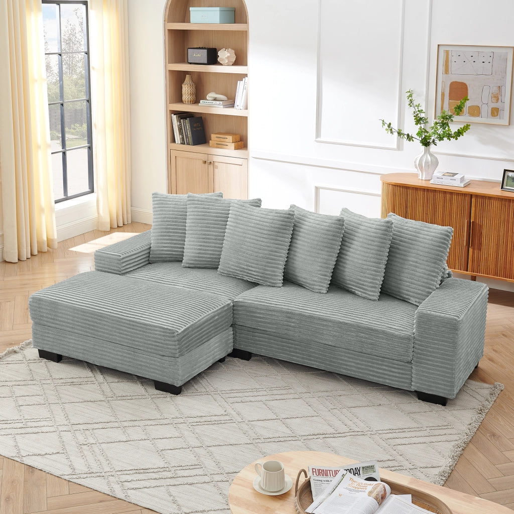 Divano angolare 4 posti con chaise longue reversibile e 6 cuscini in velluto a coste grigio