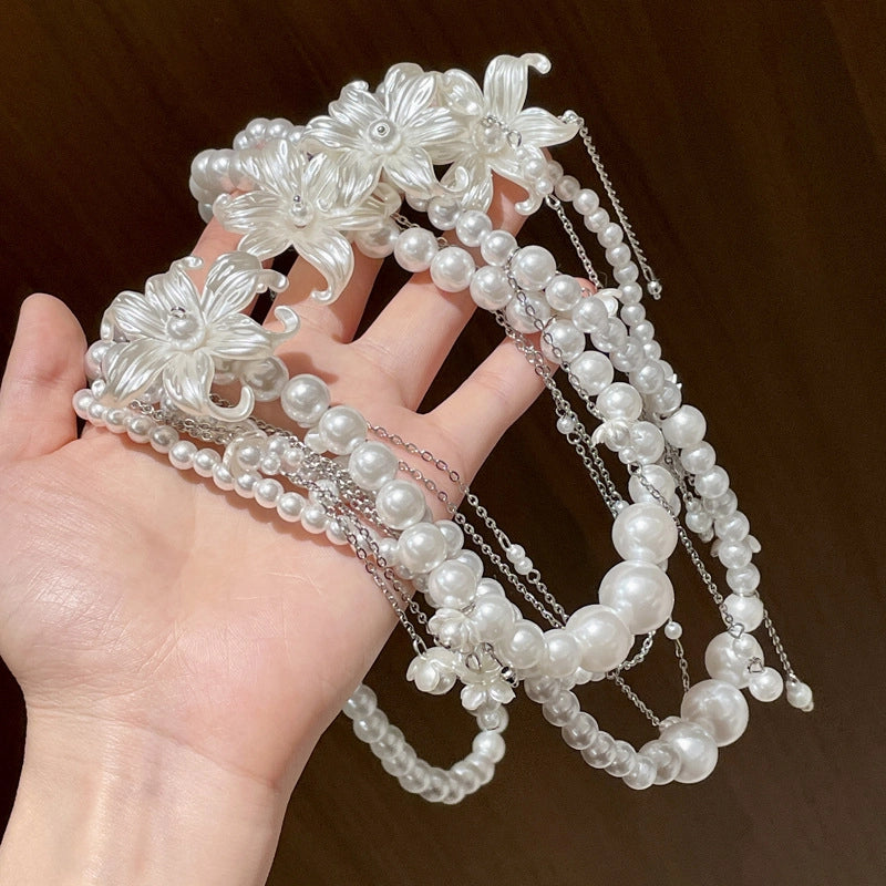 Catena per il corpo/vita francese a pi¨´ strati con nappe floreali e perle.