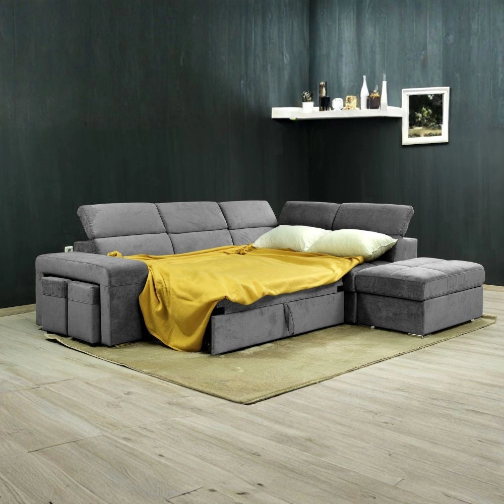 Divano angolare reversibile Positano grigio con poggiatesta regolabili, pouf e funzione letto
