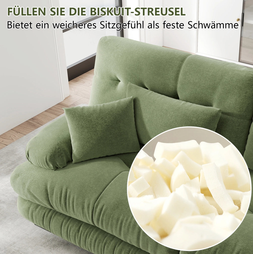 Divano modulare in chenille verde con seduta profonda e braccioli imbottiti arrotondati