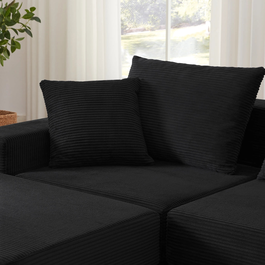 Divano modulare trasformabile in letto matrimoniale con braccioli oversize e base antiscivolo in tessuto a coste nero