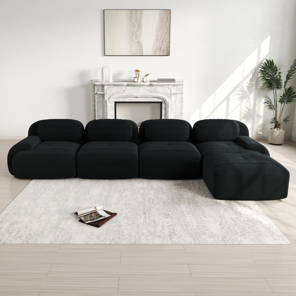 Divano angolare modulare in velluto a coste; seduta ergonomica; braccioli curvi; senza montaggio; nero
