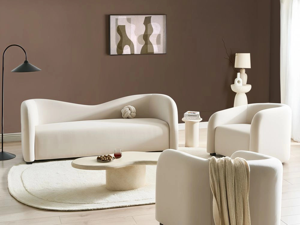Set da salotto in velluto bianco sporco con divano e poltrone imbottiti davanti e dietro, schienale curvo, design moderno