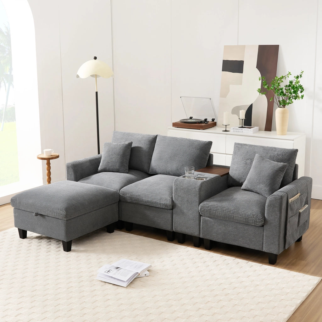 Divano angolare modulare in corduroy con consolle centrale porte USB portabicchieri e cuscini grigio per soggiorno