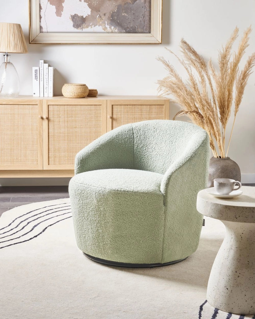 Poltrona con schienale curvo in tessuto bouclé verde chiaro base girevole 360° Art Deco dorato