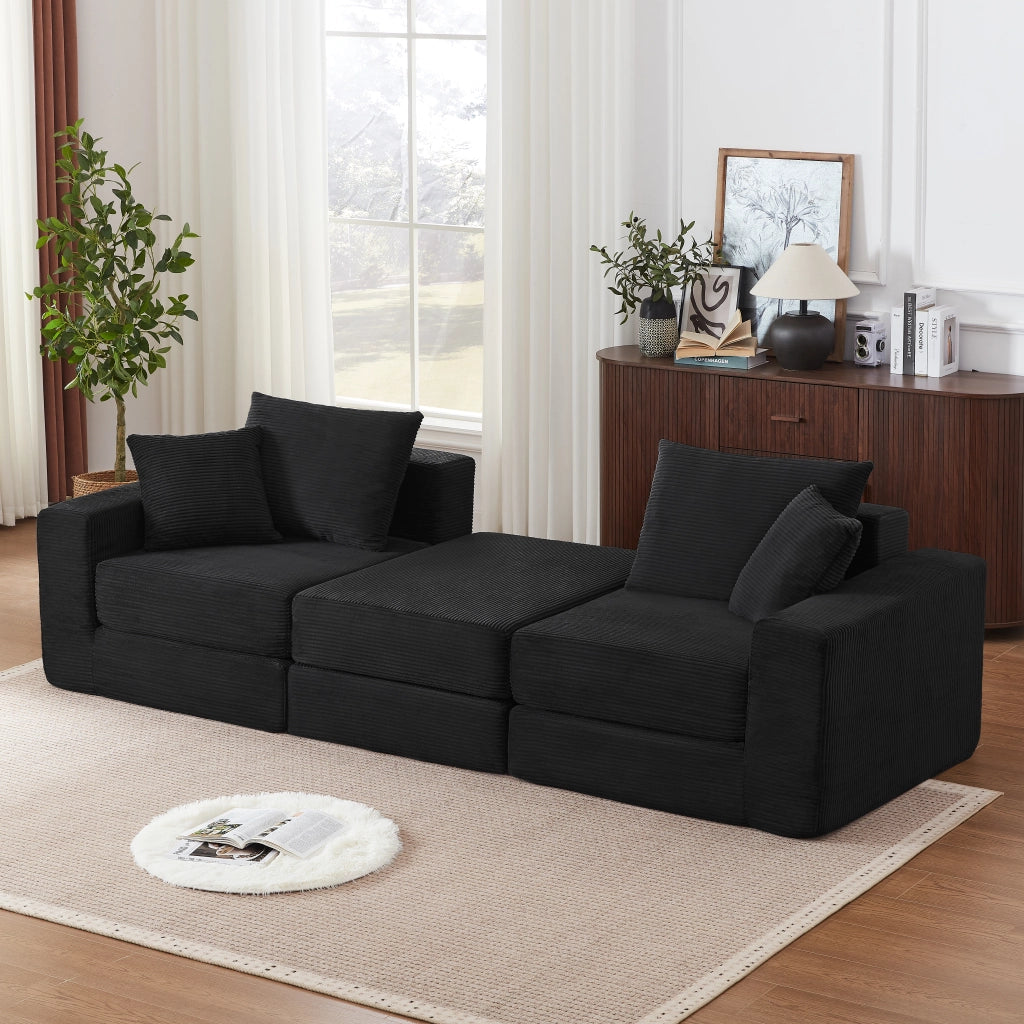 Divano modulare trasformabile in letto matrimoniale con braccioli oversize e base antiscivolo in tessuto a coste nero