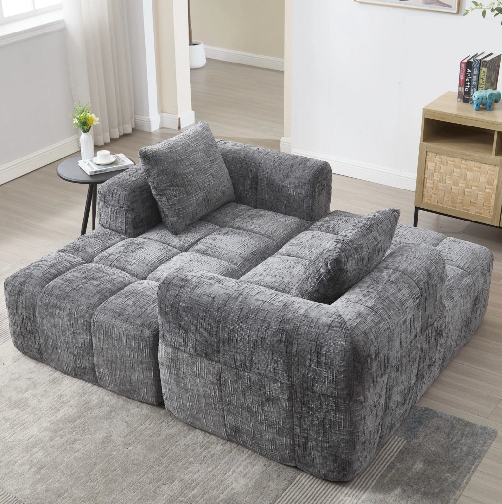 Divano componibile grigio in ciniglia con chaise longue e tasche